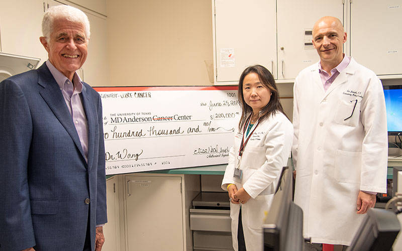 Check presentation to Dr. Yinghong (Mimi) Wang, MD Anderson Cancer Center
